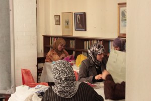 women taking a sowing class